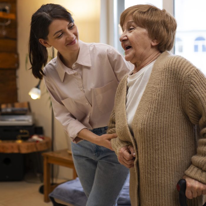 female-caretaker-her-client-s-house-taking-care-elderly-person